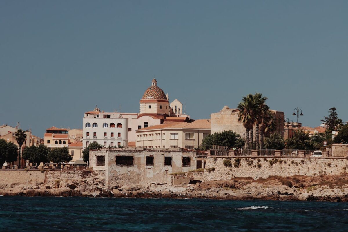 Explore the stunning historic architecture of Alghero, Sardinia showcasing Mediterranean charm and coastal beauty.